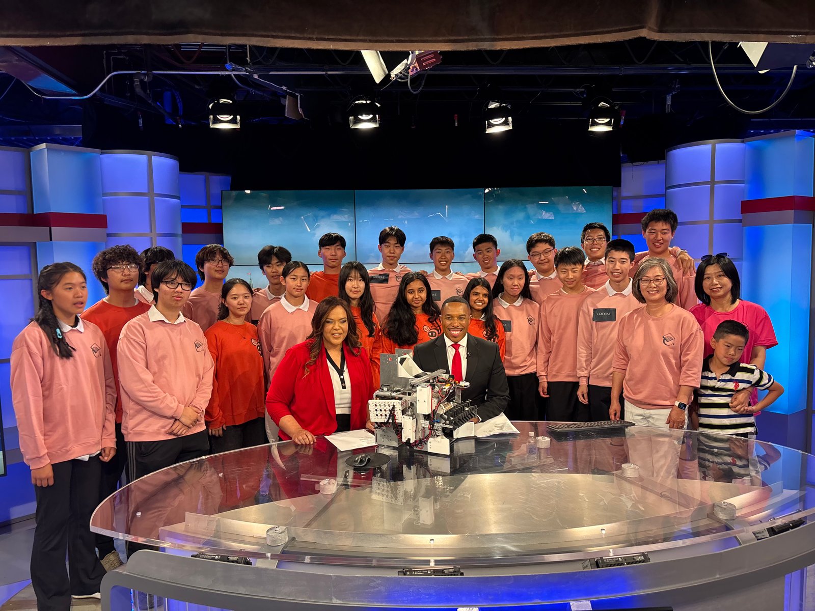 Scuola Robotics team at the CTV Ottawa studio with their robot.